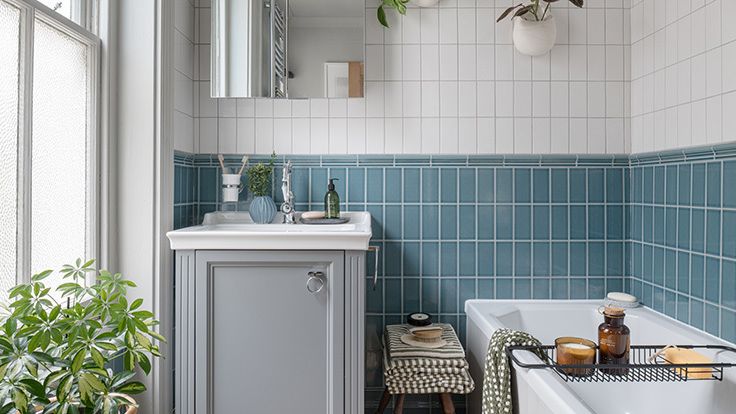 Image may contain: Plant, Indoors, Interior Design, Bathing, Bathtub, Person, and Tub