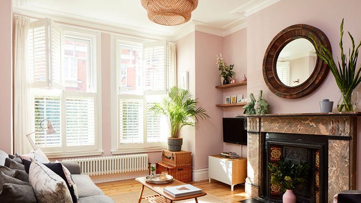 Image may contain: Plant, Book, Publication, Home Decor, Couch, Furniture, Lamp, Rug, Window, Architecture, and Building