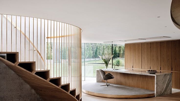 Image may contain: Indoors, Interior Design, Architecture, Building, House, Housing, Staircase, Foyer, Chair, and Furniture