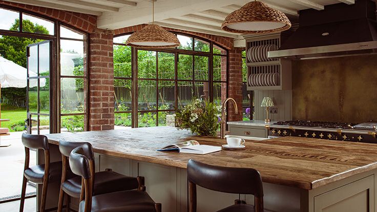 Image may contain: Book, Publication, Indoors, Interior Design, Kitchen, Kitchen Island, Chair, Furniture, and Sink