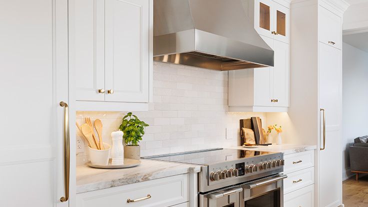 Image may contain: Indoors, Kitchen, Interior Design, Plant, Cup, Kitchen Island, and Cooktop