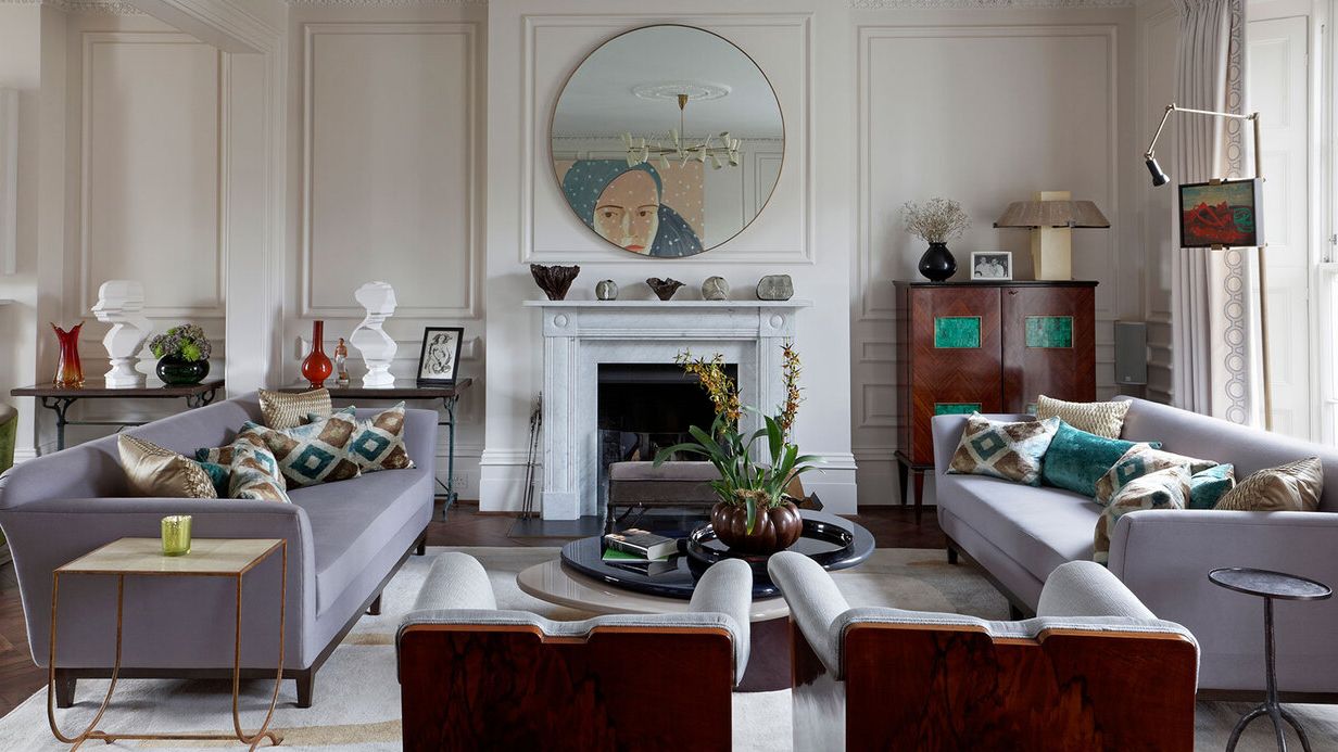 Image may contain: Home Decor, Couch, Furniture, Cup, Lamp, Table, Architecture, Building, Indoors, Living Room, and Room