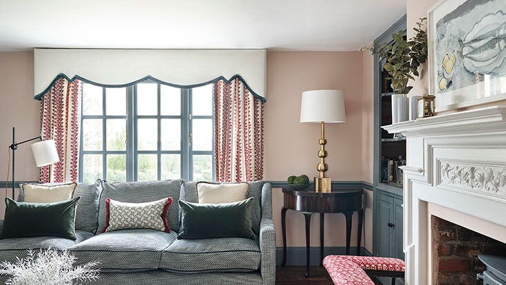 Image may contain: Lamp, Couch, Furniture, Home Decor, Architecture, Building, Indoors, Living Room, Room, Desk, and Table