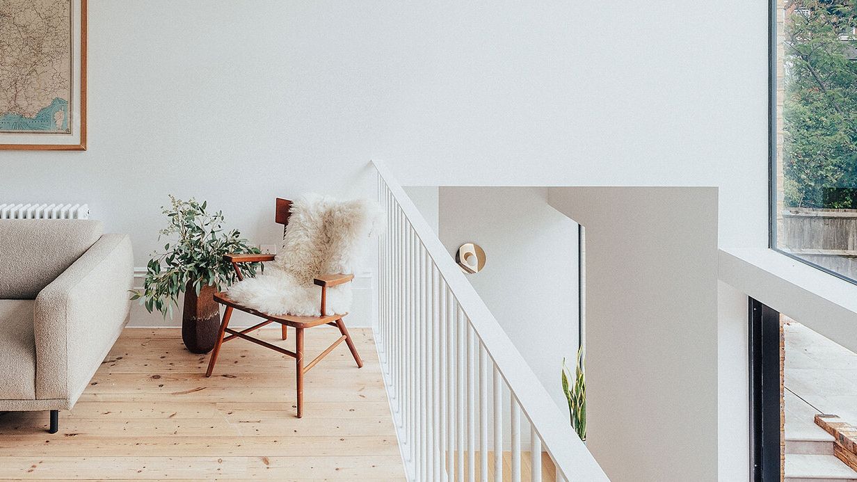 Image may contain: Chair, Furniture, Plant, Art, Painting, Architecture, Balcony, Building, Indoors, and Interior Design