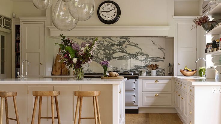 Image may contain: Indoors, Interior Design, Kitchen, Kitchen Island, Cup, Sink, Sink Faucet, Banana, Food, Fruit, and Plant