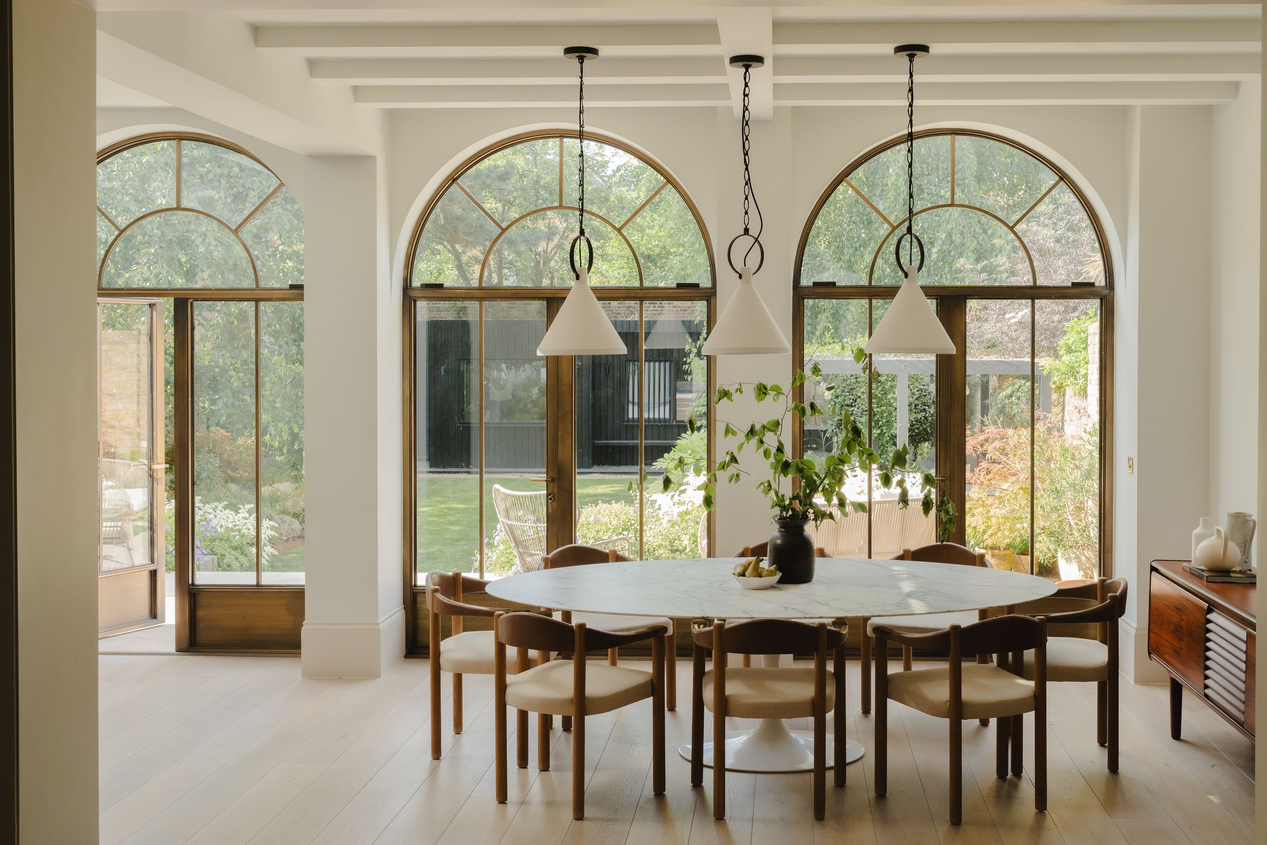 Image may contain: Architecture, Building, Dining Room, Dining Table, Furniture, Indoors, Room, Table, and Lamp