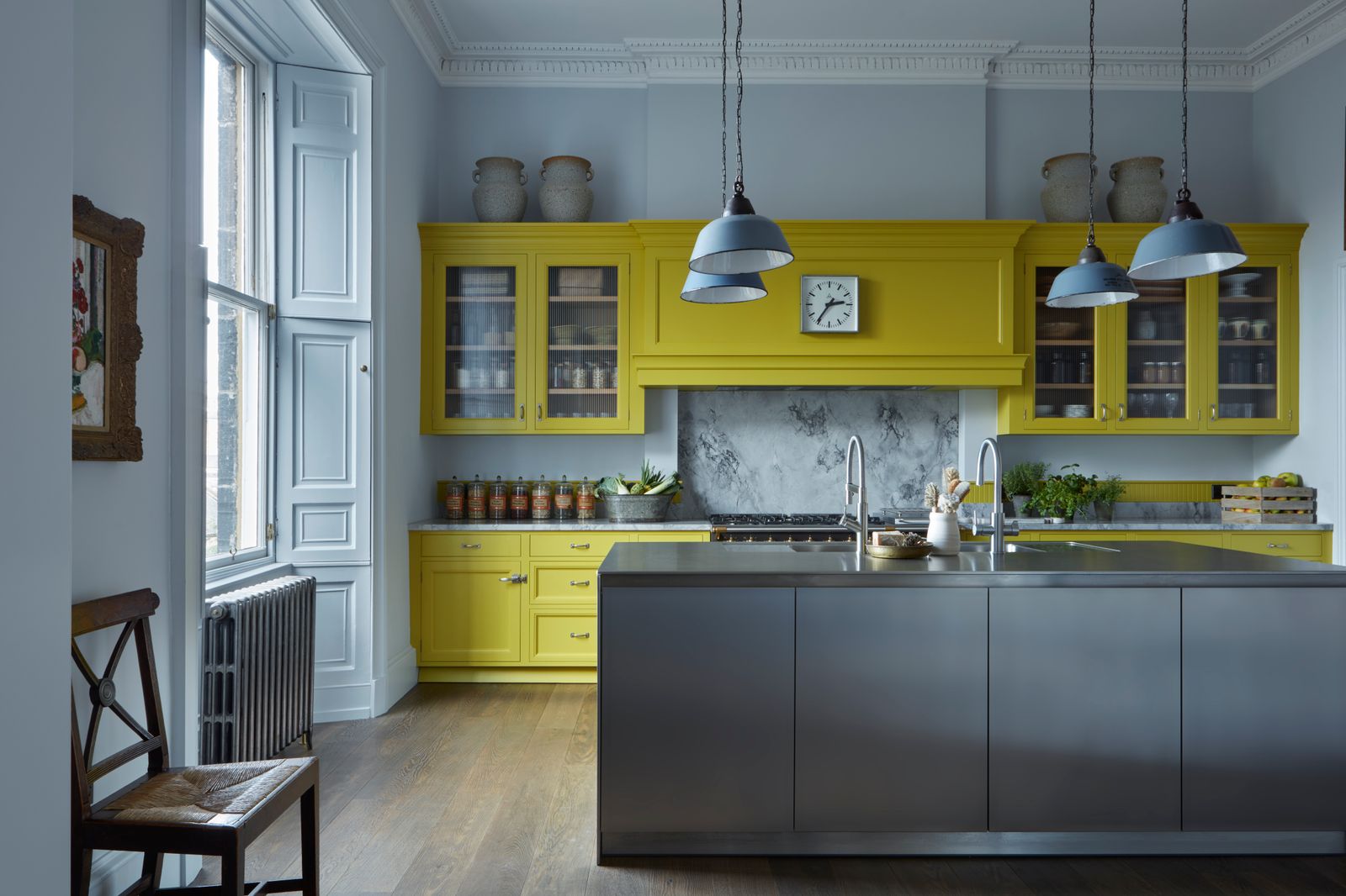 Image may contain Indoors Interior Design Kitchen Lamp Chair Furniture and Kitchen Island