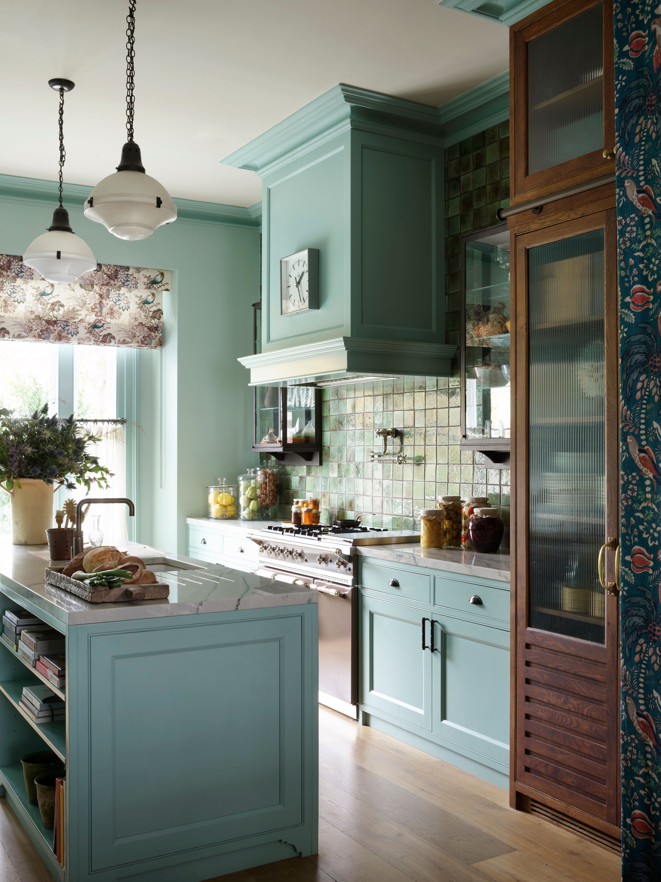 Image may contain: Indoors, Interior Design, Kitchen, Lamp, Plant, and Kitchen Island
