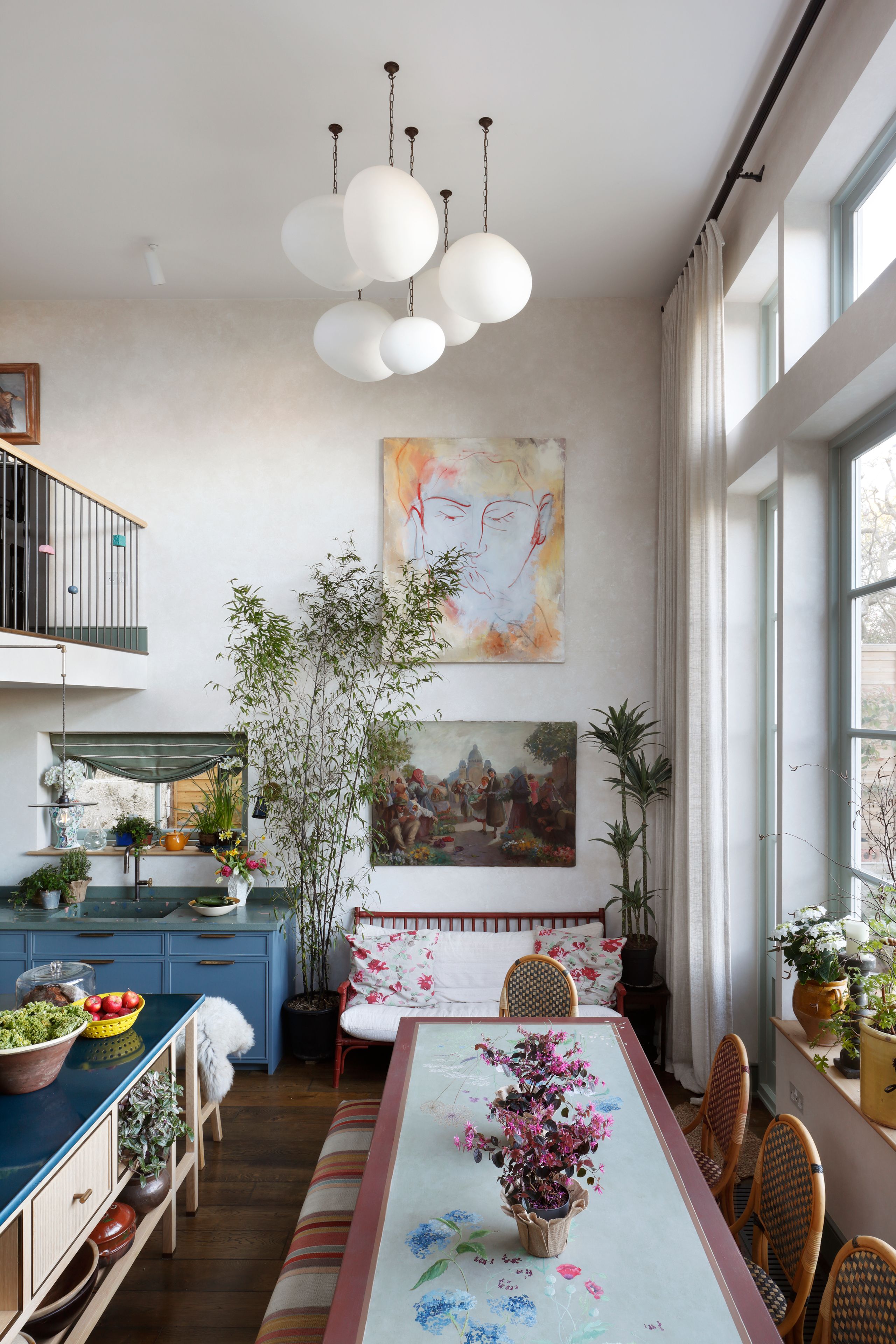 Image may contain: Architecture, Building, Dining Room, Dining Table, Furniture, Indoors, Room, Table, Home Decor, and Plant