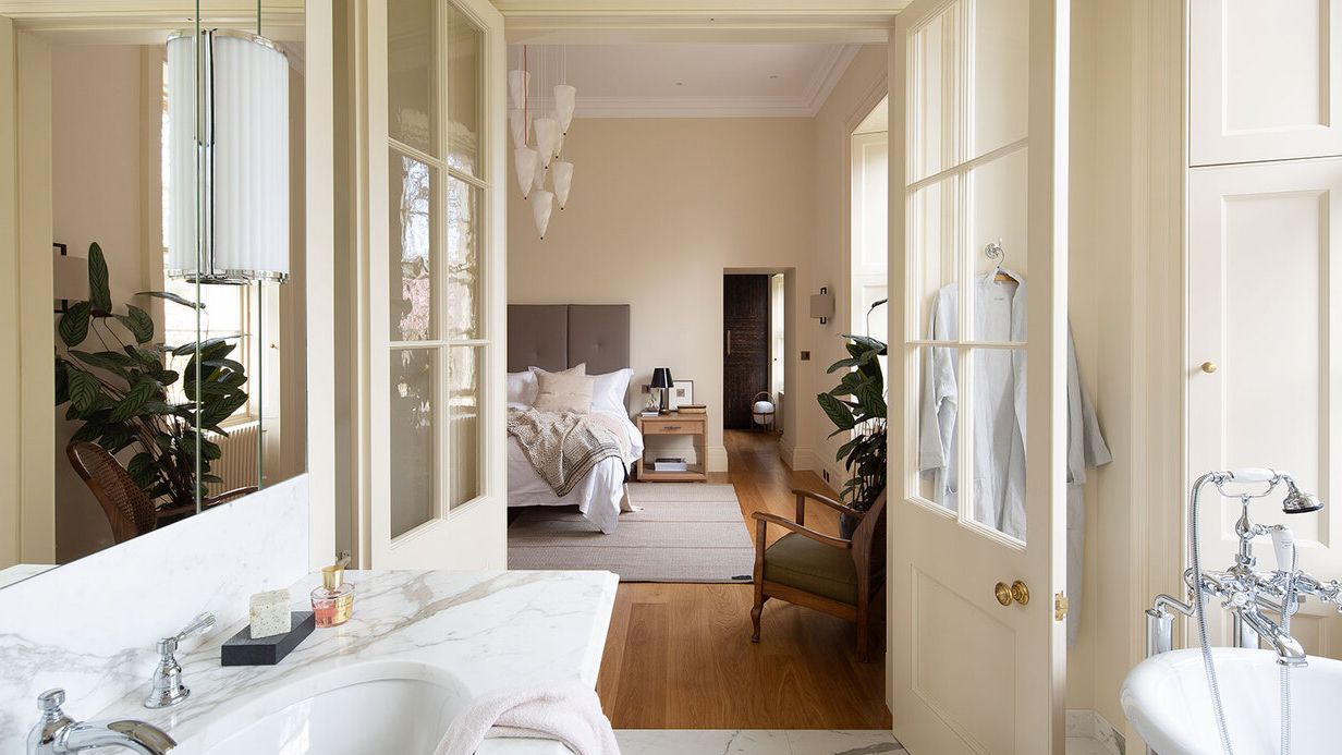 Image may contain: Door, Chair, Furniture, Sink, Bed, Sink Faucet, Indoors, Interior Design, Architecture, and Building