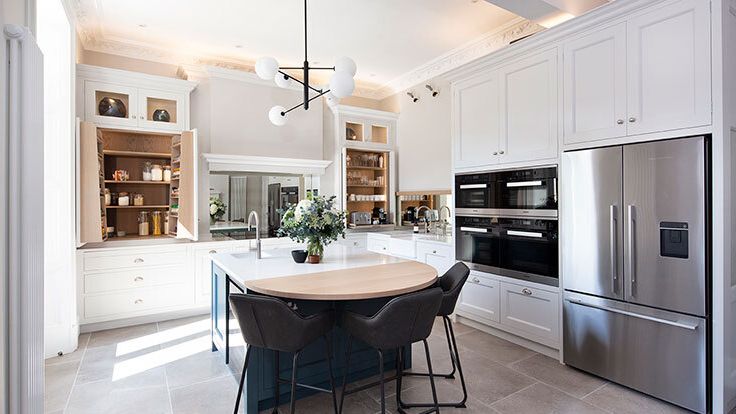 Image may contain: Architecture, Building, Dining Room, Dining Table, Furniture, Indoors, Room, Table, and Interior Design