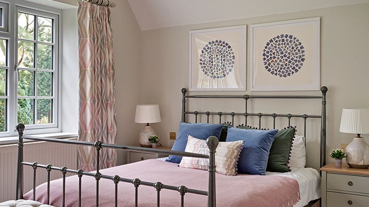 Image may contain: Cushion, Home Decor, Lamp, Bed, Furniture, Plant, Indoors, Interior Design, Art, Painting, and Bedroom