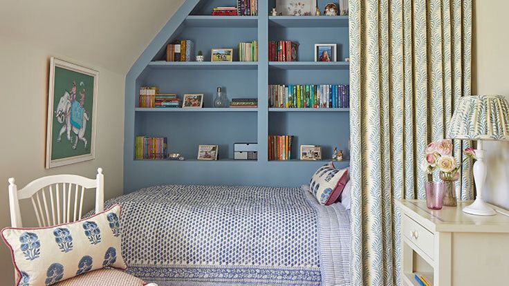 Image may contain: Lamp, Chair, Furniture, Cushion, Home Decor, Art, Painting, Indoors, Interior Design, Desk, Table, and Bed