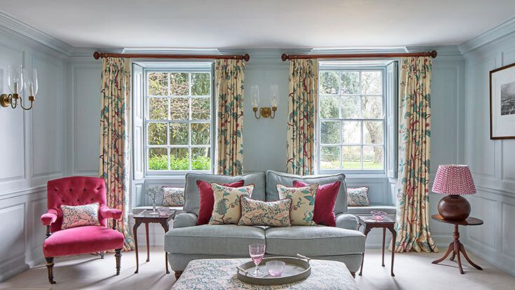 Image may contain: Lamp, Chair, Furniture, Home Decor, Couch, Desk, Table, Window, Cup, Plant, Art, and Painting