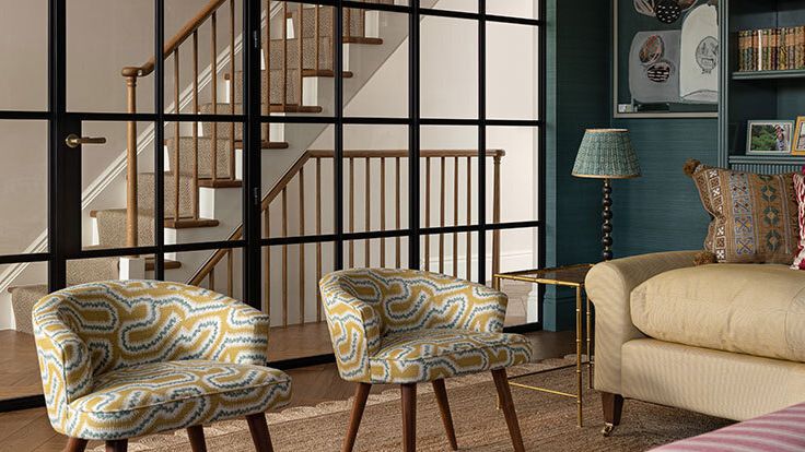 Image may contain: Lamp, Architecture, Building, Furniture, Indoors, Living Room, Room, Chair, Home Decor, Couch, and Bed