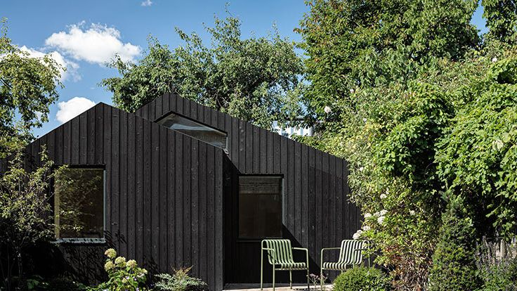 Image may contain: Indoors, Interior Design, Architecture, Building, Cottage, House, Housing, Backyard, Nature, and Outdoors