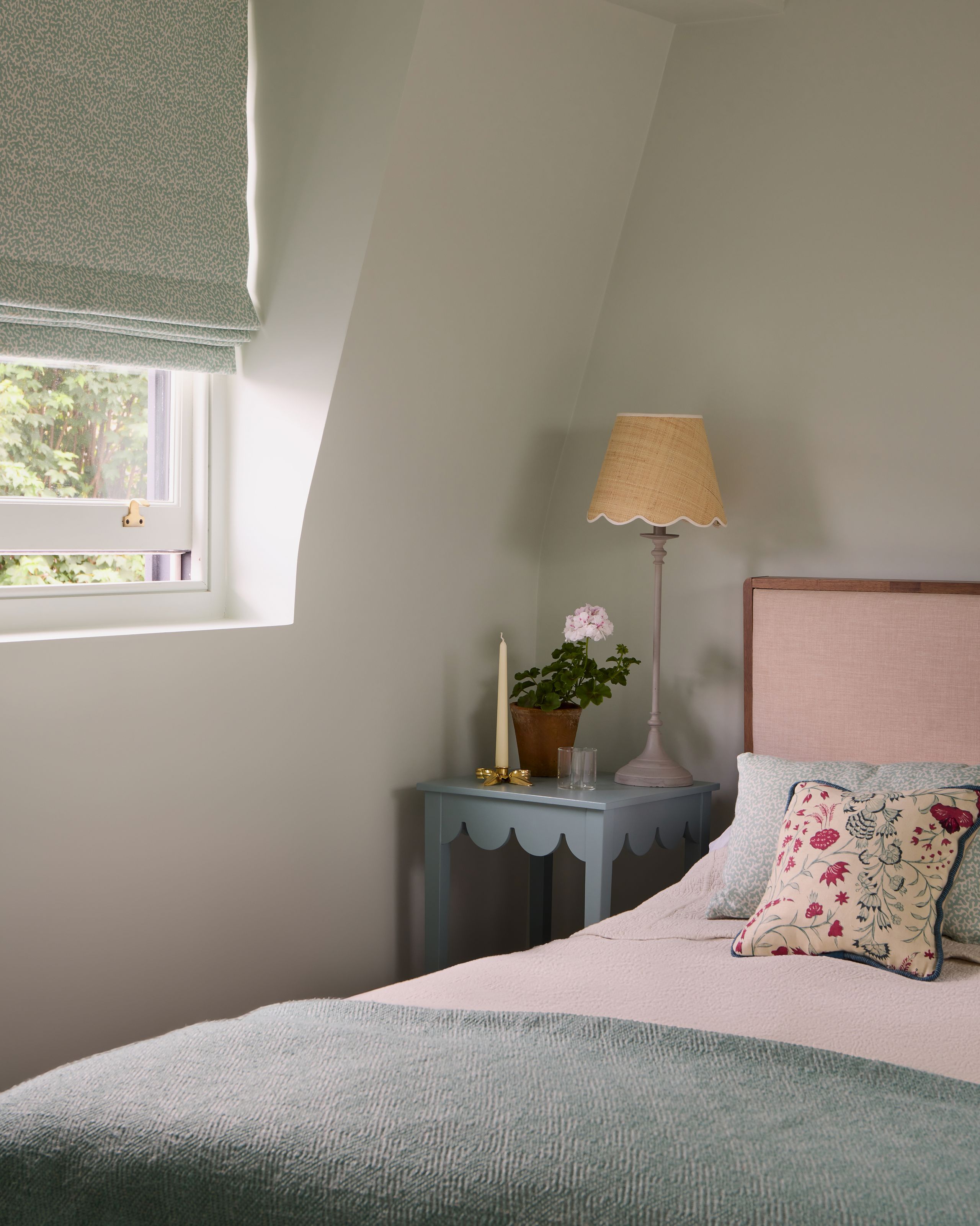 Image may contain: Cushion, Home Decor, Lamp, Cup, Table Lamp, Furniture, Pillow, Bed, and Candle