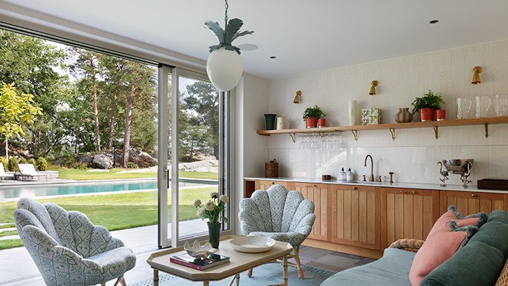 Image may contain: Book, Publication, Coffee Table, Furniture, Table, Home Decor, Sink, Sink Faucet, Couch, Plant, and Chair