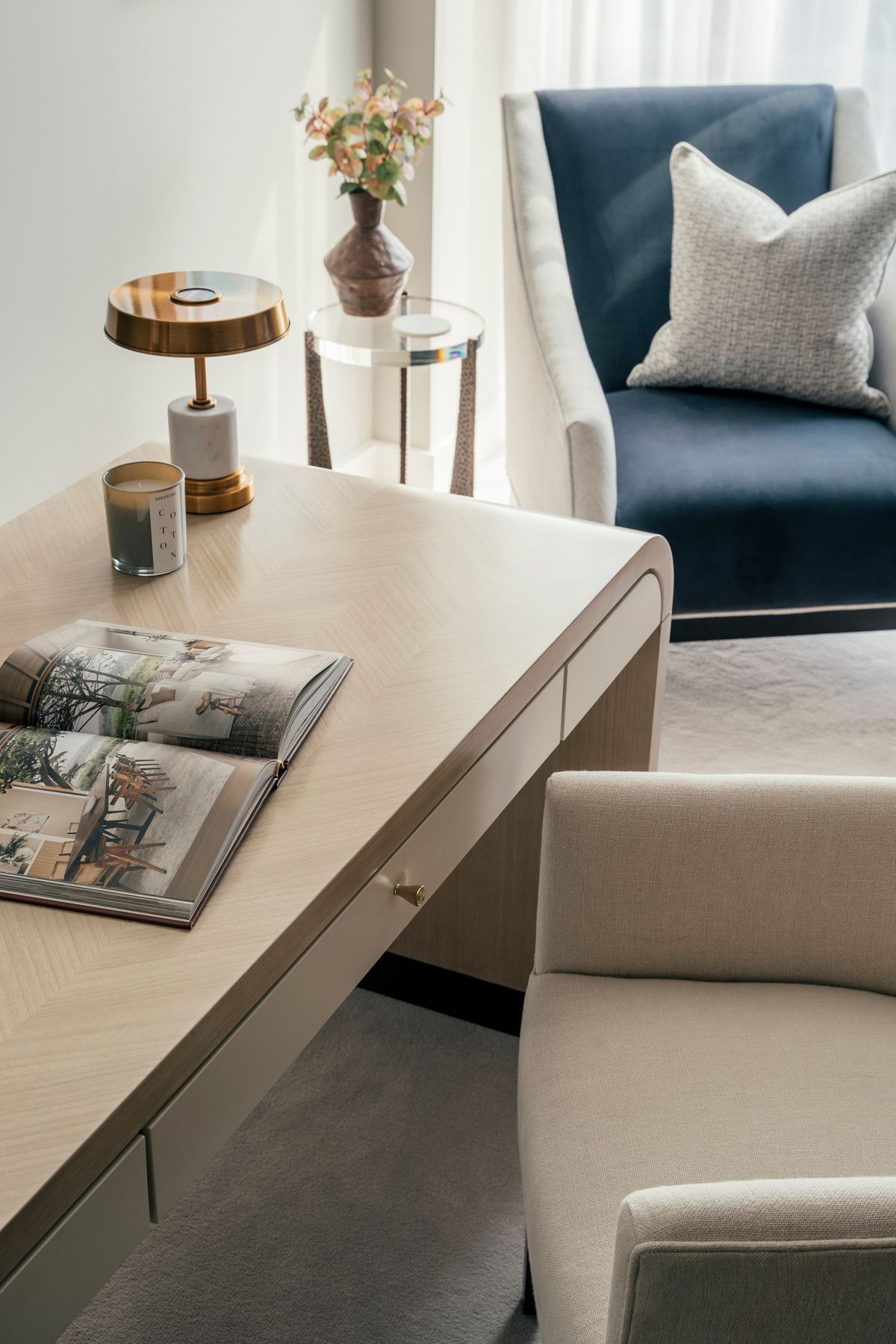 Image may contain: Furniture, Table, Book, Publication, Coffee Table, Tabletop, Cushion, Home Decor, Couch, and Indoors