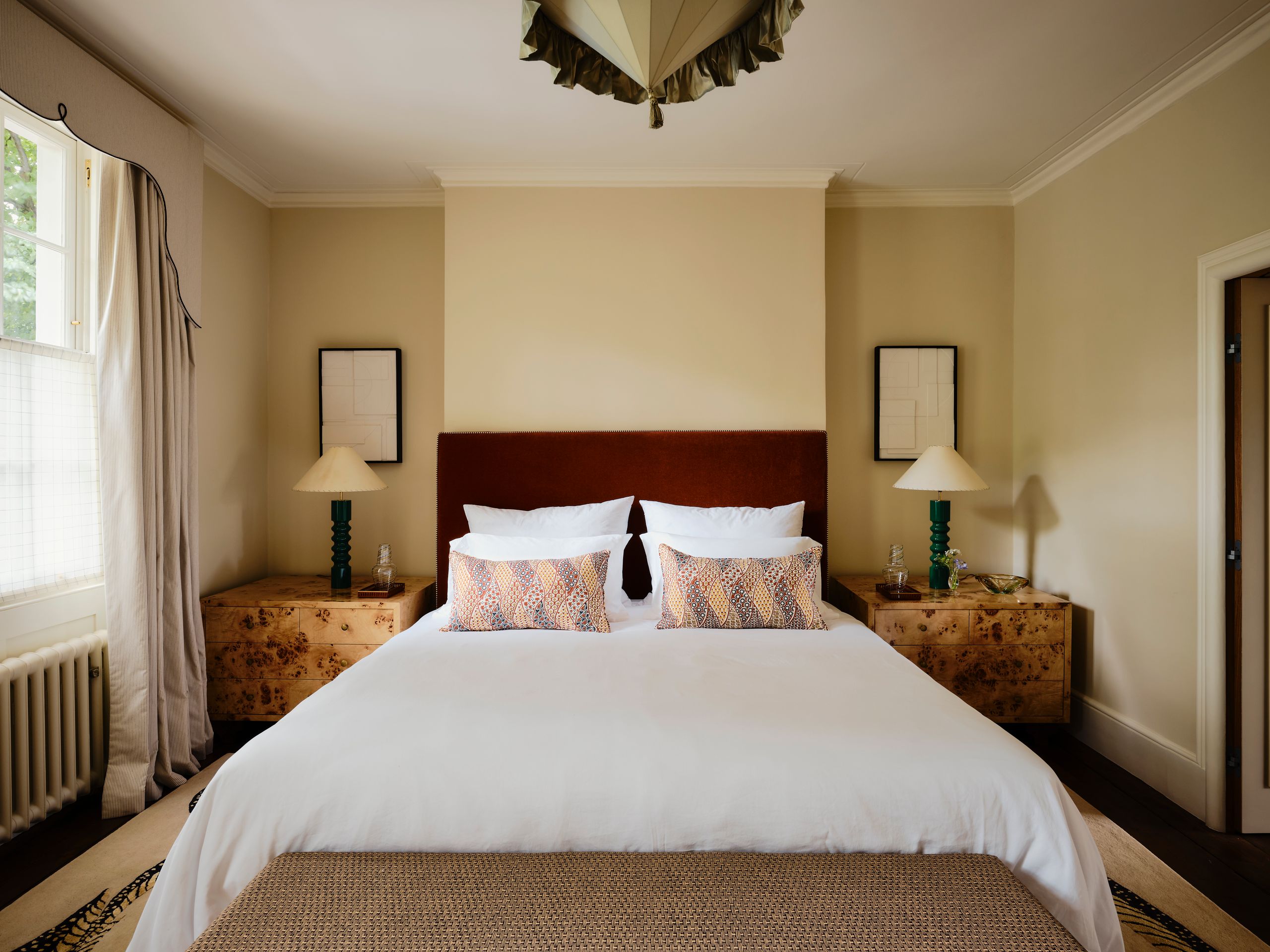 Image may contain: Corner, Cushion, Home Decor, Lamp, Bed, Furniture, Indoors, Interior Design, Pillow, Table Lamp, and Art