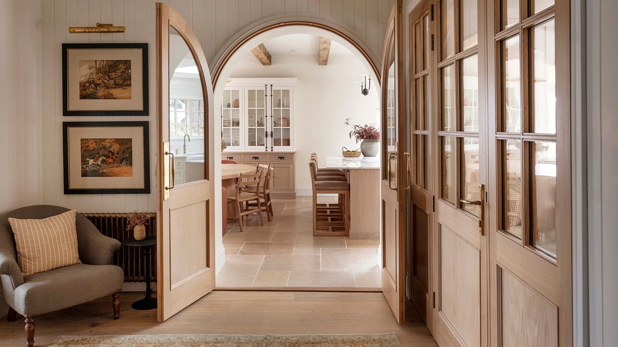 Image may contain: Indoors, Interior Design, Art, Painting, Door, Home Decor, Rug, Chair, Furniture, Floor, and Architecture