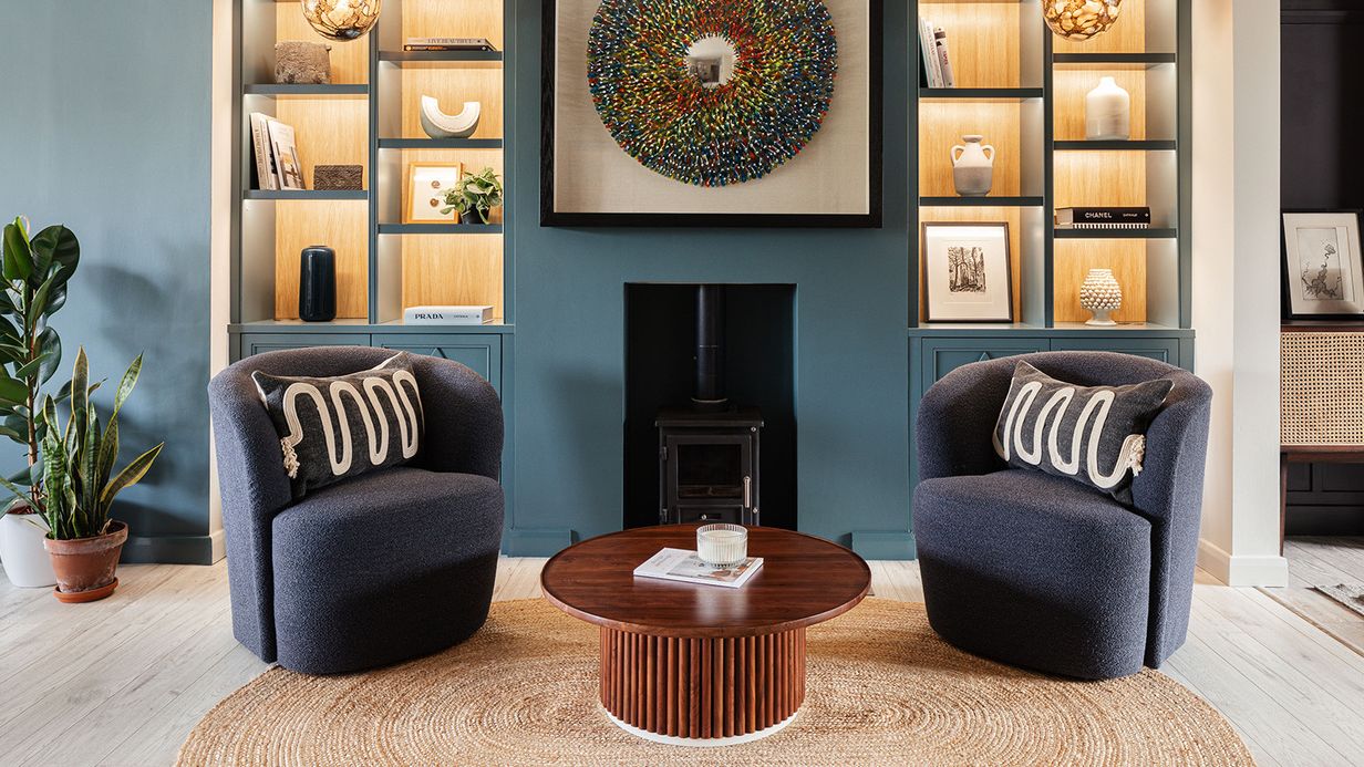 Image may contain: Book, Publication, Home Decor, Furniture, Table, Coffee Table, Plant, Rug, Architecture, and Building