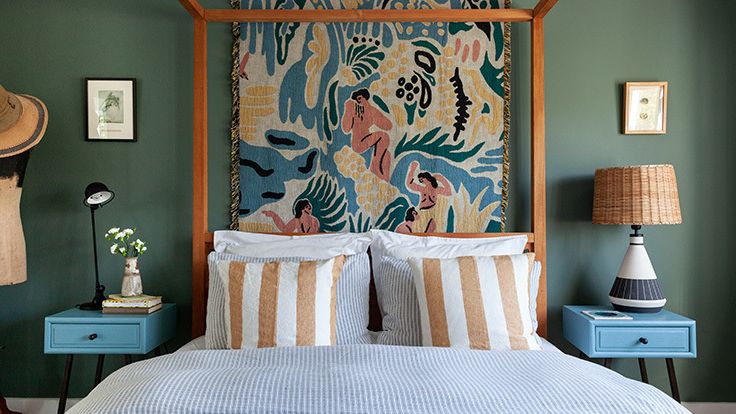 Image may contain: Lamp, Cushion, Home Decor, Art, Painting, Furniture, Bed, Bedroom, Indoors, Room, Clothing, and Hat