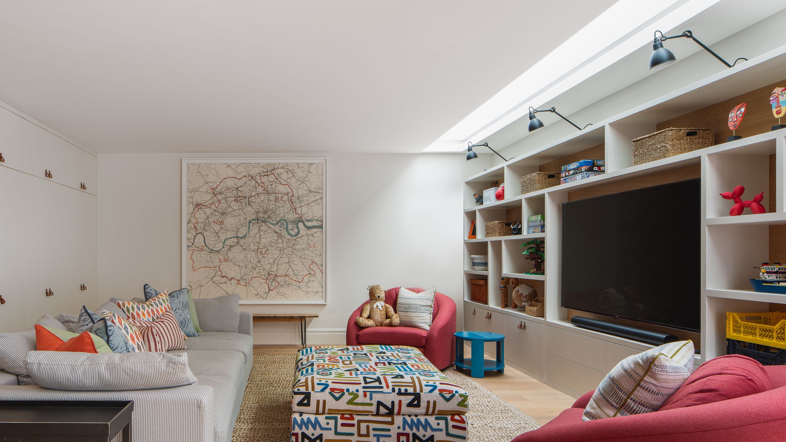 Image may contain: Toy, Architecture, Building, Furniture, Indoors, Living Room, Room, Home Decor, Lamp, Couch, and Rug