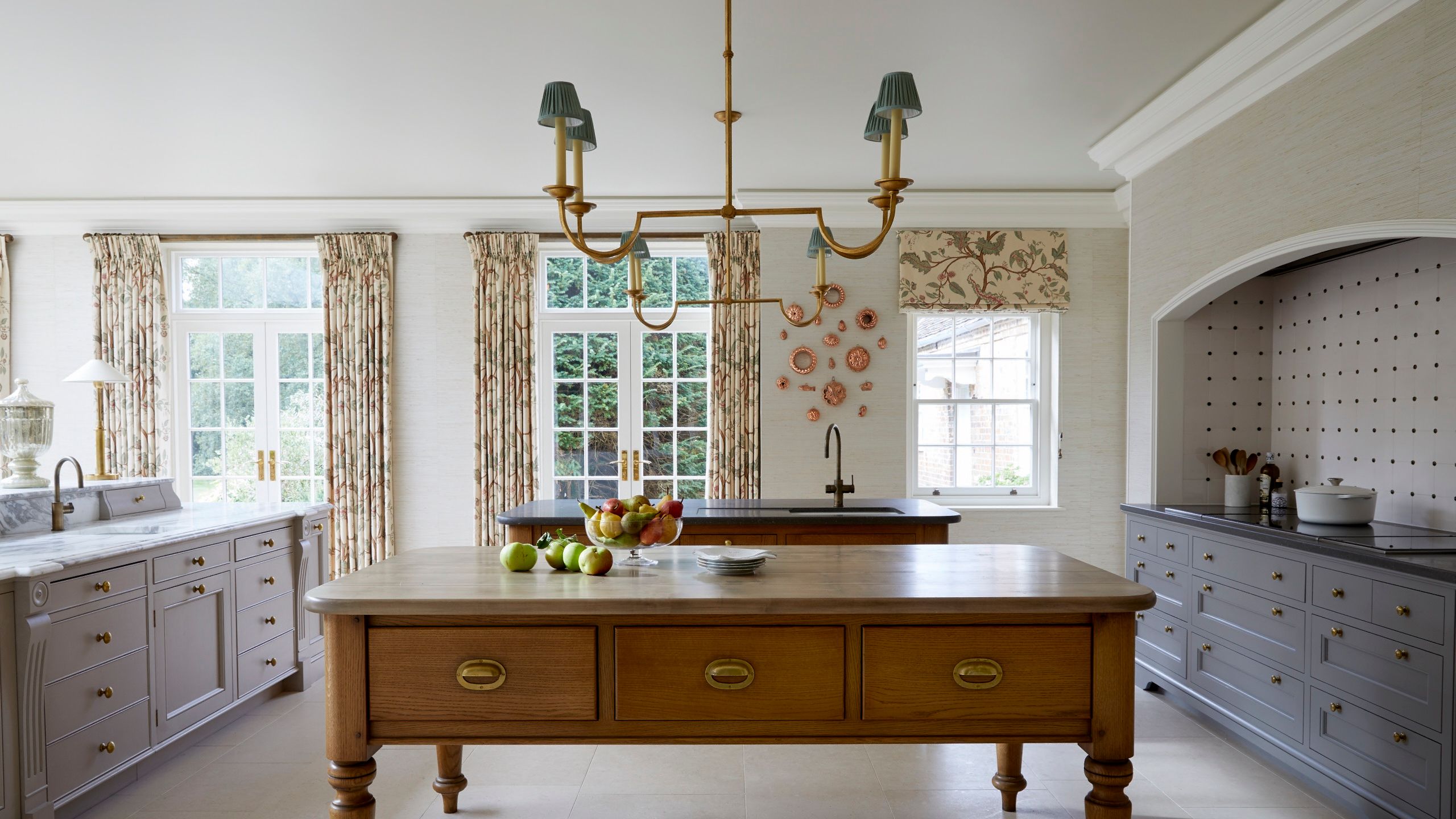 Image may contain: Indoors, Kitchen, Chandelier, Lamp, Furniture, Sideboard, Interior Design, Sink, and Sink Faucet