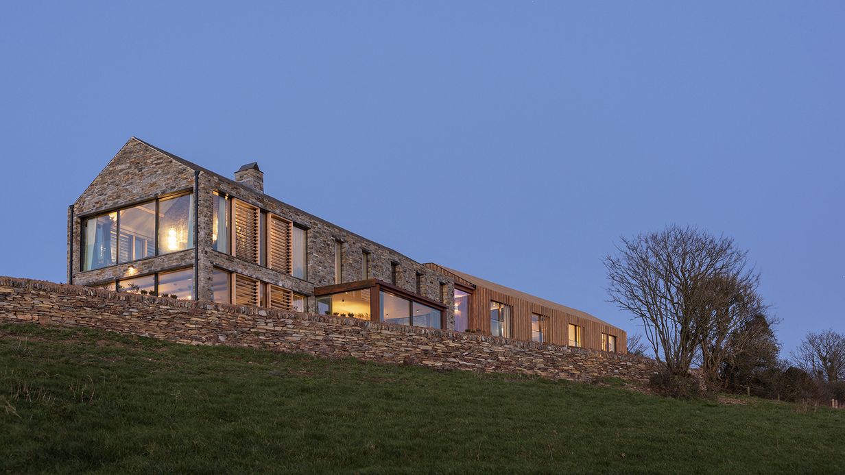 Image may contain: Architecture, Building, Cottage, House, Housing, Villa, Grass, and Plant