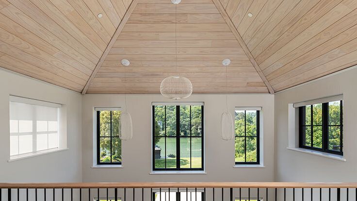 Image may contain: Indoors, Interior Design, Lamp, Cup, Window, and Railing