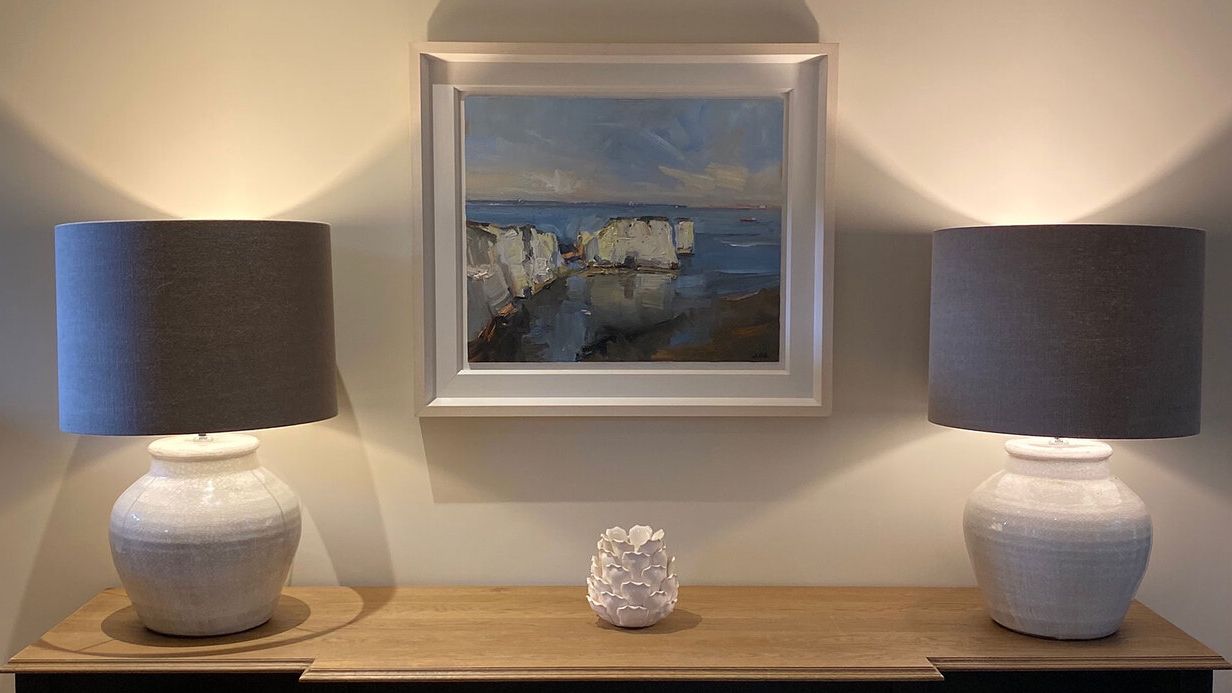 Image may contain: Lamp, Table Lamp, Art, Painting, Desk, Furniture, and Table