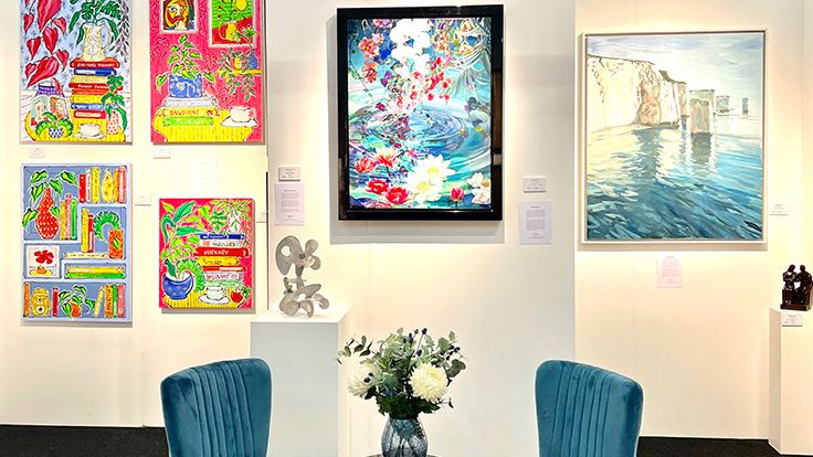 Image may contain: Book, Publication, Chair, Furniture, Art, Painting, Desk, Table, Computer Hardware, and Electronics