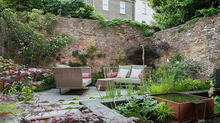 Image may contain: Backyard, Nature, Outdoors, Yard, Garden, Pond, Water, Bench, Furniture, Plant, and Potted Plant