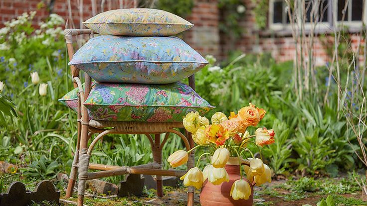Image may contain: Cushion, Home Decor, Garden, Nature, Outdoors, Plant, Potted Plant, Indoors, Interior Design, and Chair
