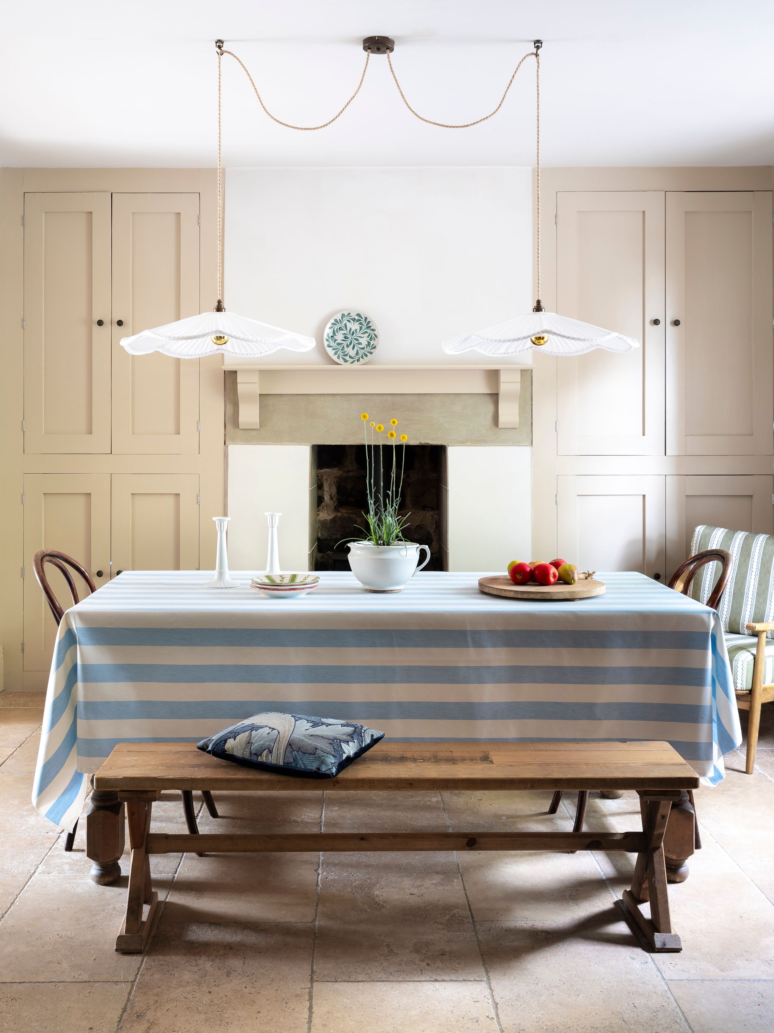 Image may contain: Architecture, Building, Dining Room, Dining Table, Furniture, Indoors, Room, Table, Tablecloth, and Bench