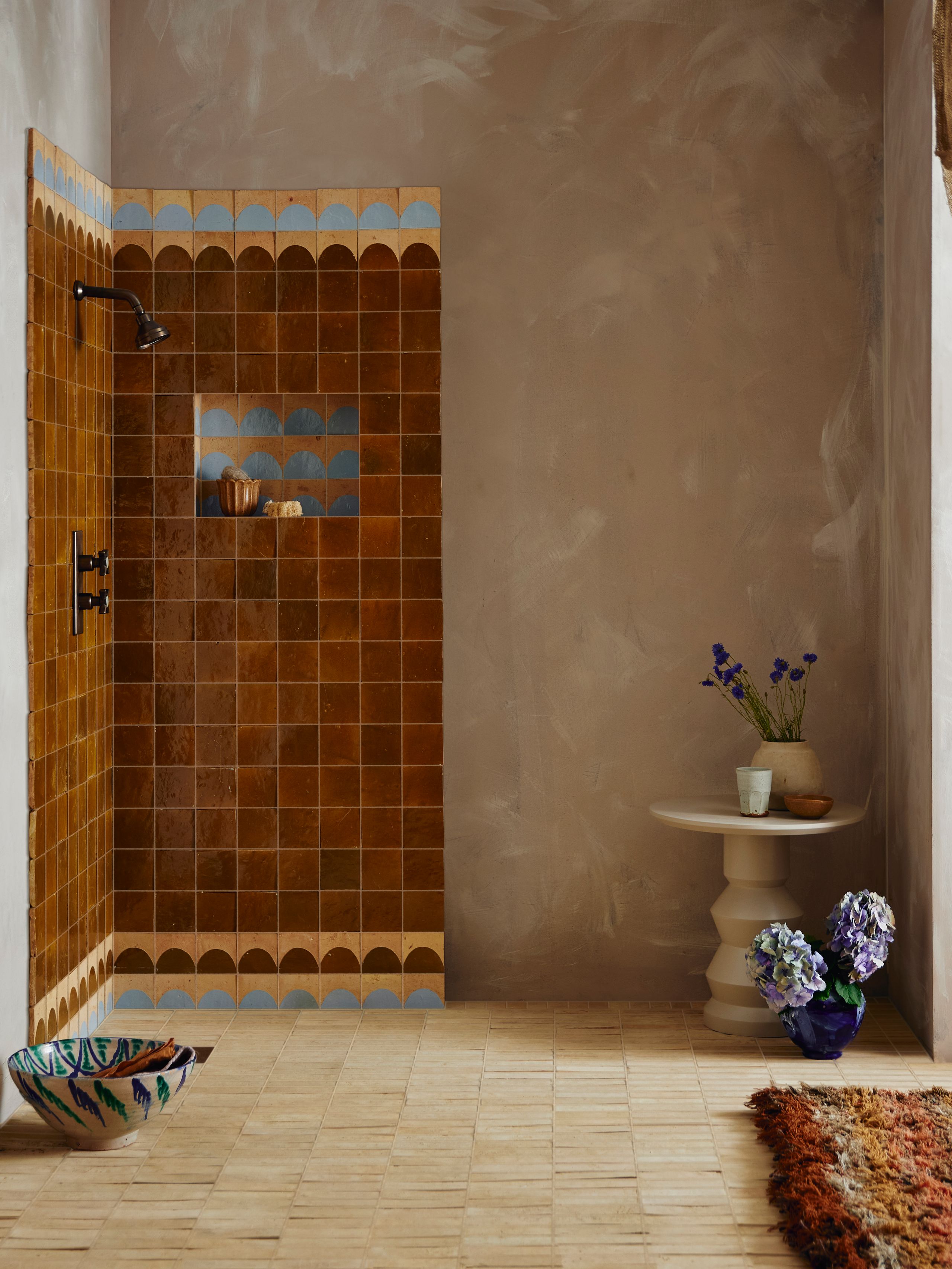 Image may contain: Indoors, Interior Design, Cup, Home Decor, Rug, Desk, Furniture, Table, Bathroom, Room, and Shower Faucet