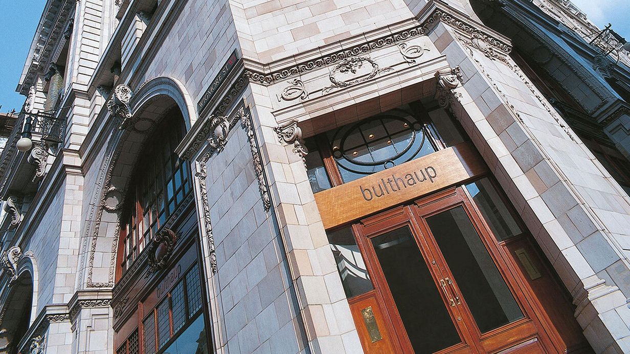 Image may contain: City, Urban, Architecture, Building, Office Building, Book, Publication, and Door