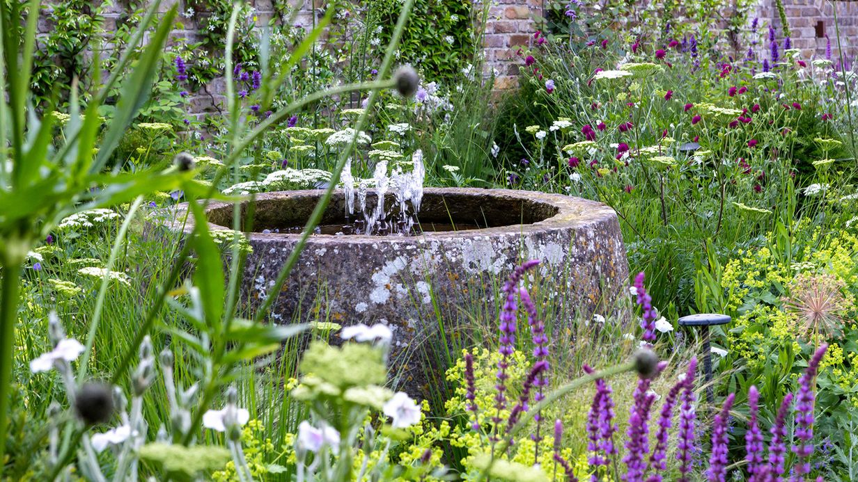 Image may contain: Garden, Nature, Outdoors, Architecture, Fountain, and Water