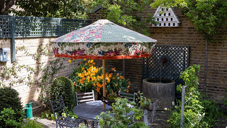 Image may contain: Backyard, Nature, Outdoors, Yard, Garden, Architecture, Building, House, Housing, Patio, and Chair