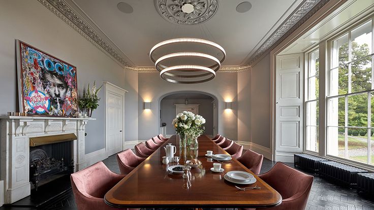 Image may contain: Architecture, Building, Dining Room, Dining Table, Furniture, Indoors, Room, Table, Cup, Chair, and Lamp