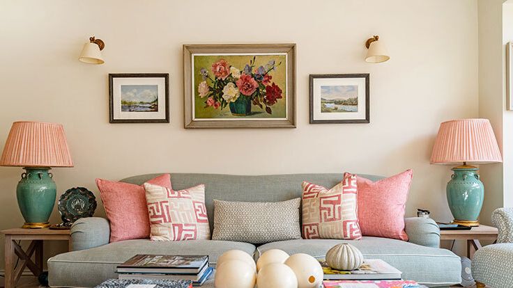 Image may contain: Home Decor, Lamp, Cushion, Couch, Furniture, Chair, Art, Painting, Table, Pillow, Egg, Food, and Desk