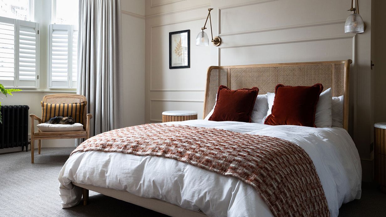 Image may contain: Chair, Furniture, Home Decor, Cushion, Bed, Lamp, Indoors, Interior Design, Art, Painting, and Pillow