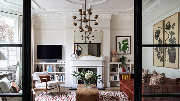 Image may contain: Home Decor, Chair, Furniture, Lamp, Art, Painting, Rug, Computer Hardware, Electronics, and Hardware