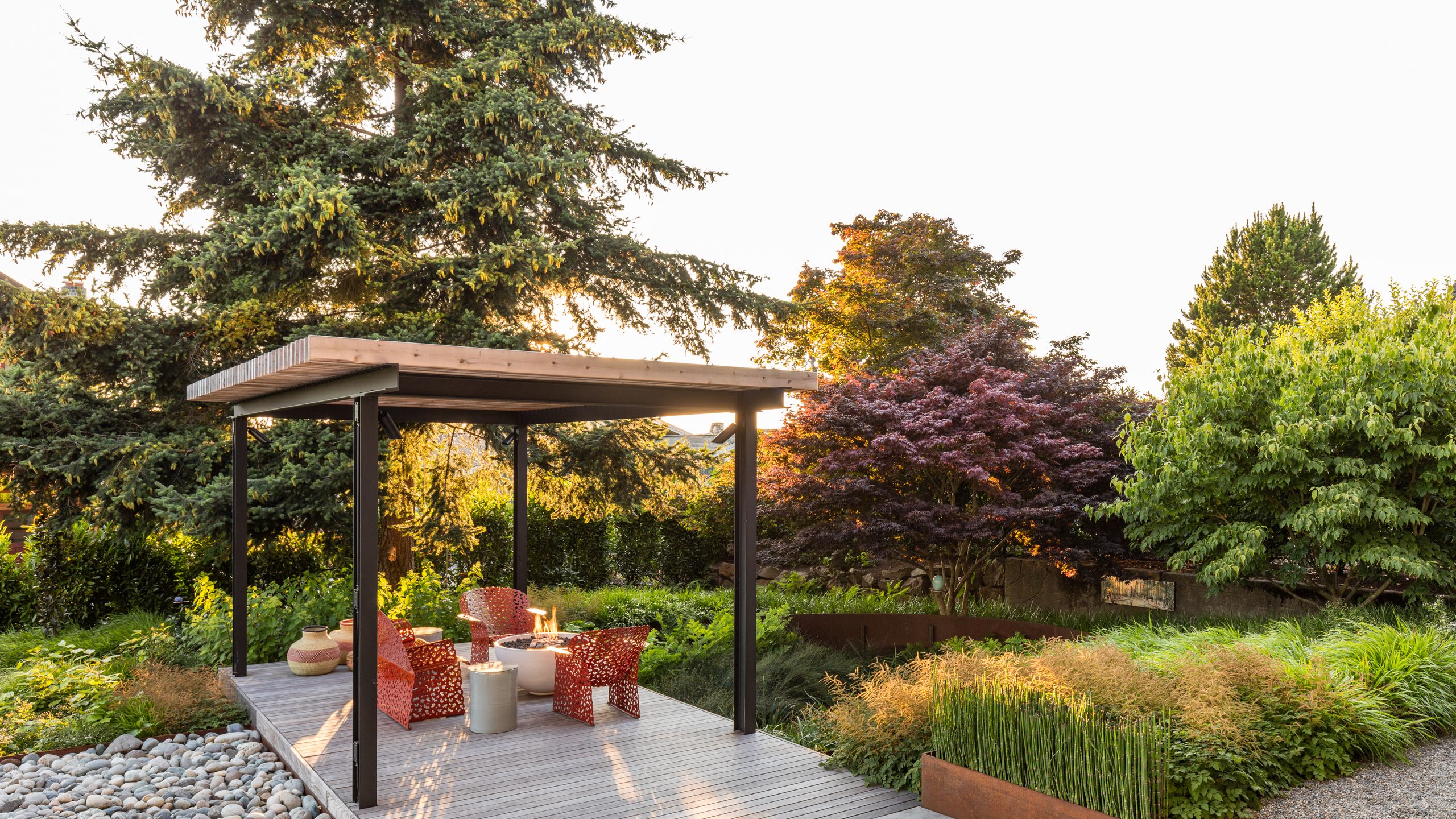 Image may contain: Backyard, Nature, Outdoors, Yard, Architecture, Building, House, Housing, Porch, Garden, and Patio