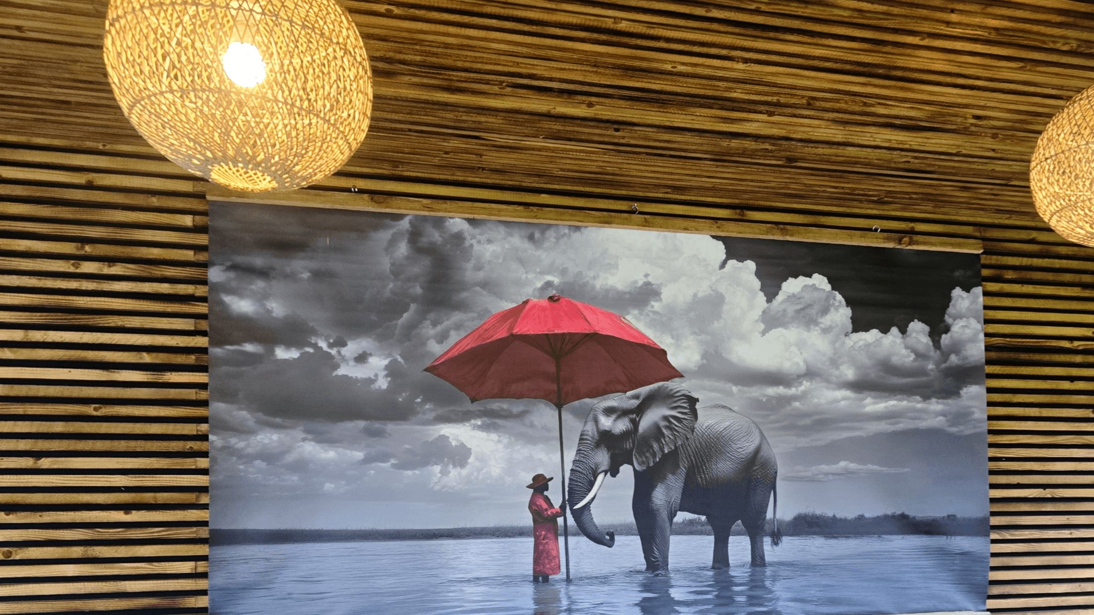 Image may contain: Indoors, Interior Design, Person, Architecture, Building, Outdoors, Shelter, Animal, Elephant, and Mammal