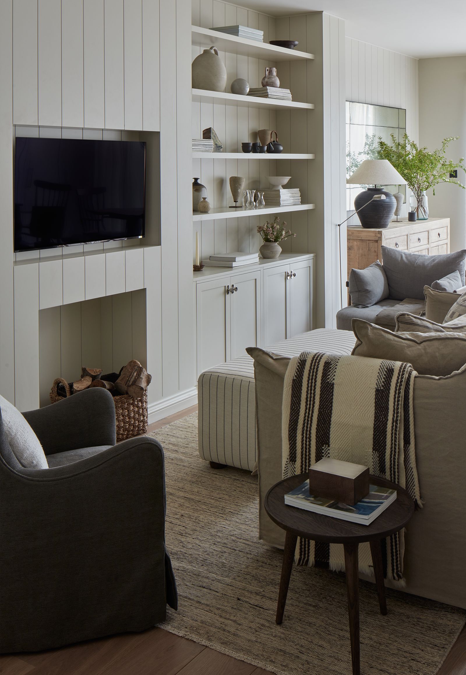 Image may contain: Book, Publication, Architecture, Building, Furniture, Indoors, Living Room, Room, Lamp, and Home Decor