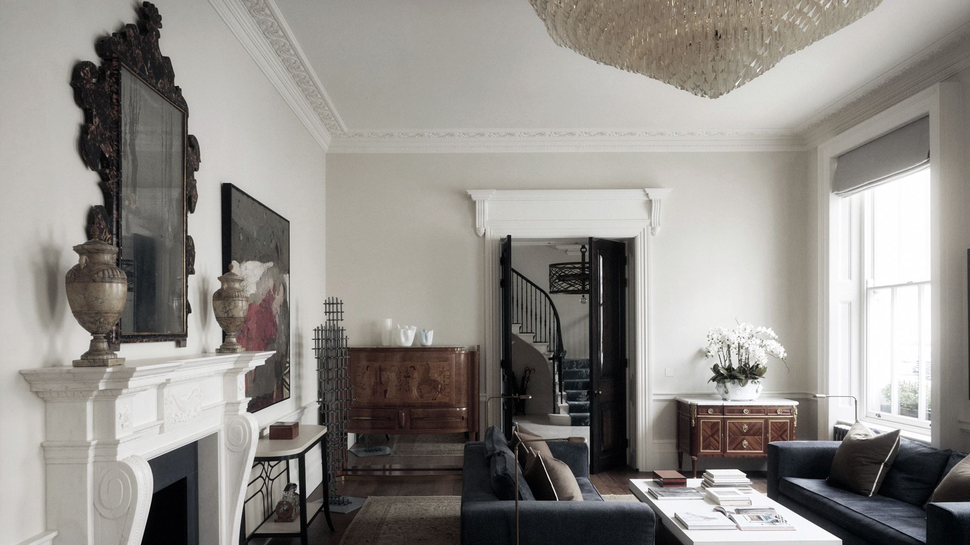 Image may contain: Architecture, Building, Furniture, Indoors, Living Room, Room, Home Decor, Couch, Table, and Lamp