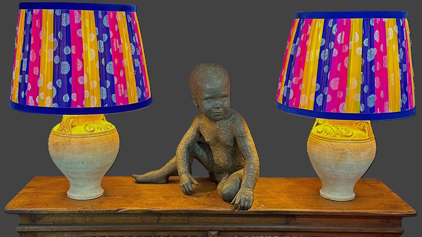 Image may contain: Lamp, Table Lamp, Lampshade, and Person