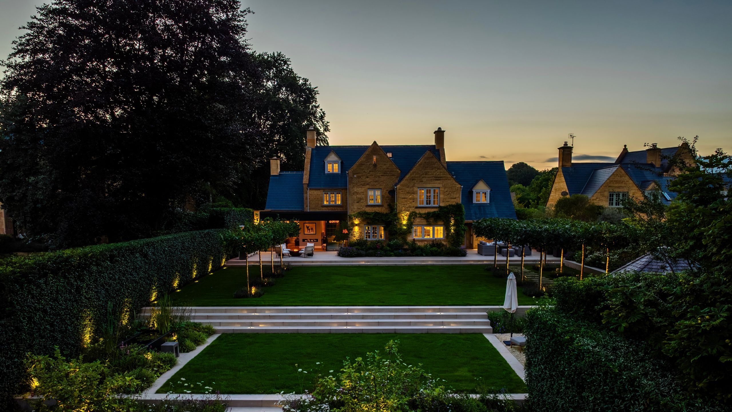 Image may contain: Bench, Furniture, Architecture, Building, Housing, Outdoors, House, Manor, Grass, and Plant